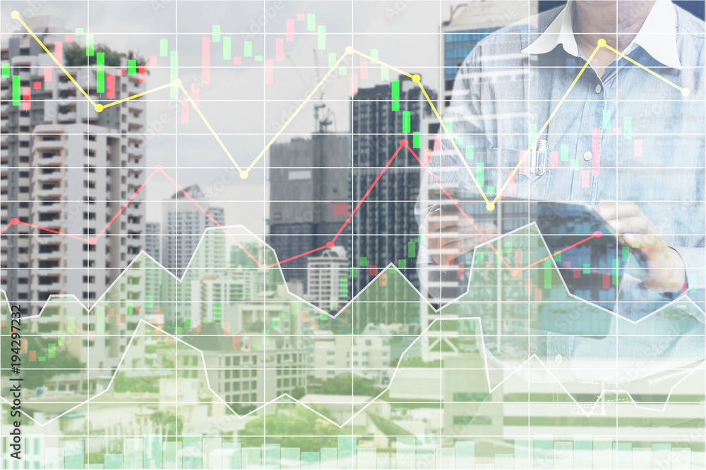 Businessman standing and operate tablet to control and connect big data of real estate sector stock market index with chart and graph background. Businessman standing and operate tablet to control and connect big data of real estate sector stock market index with chart and graph background.