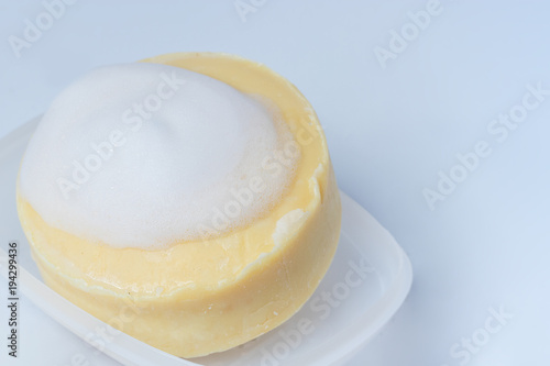 Yellow soap on a white background.