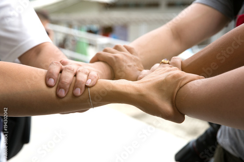 Hand hold togethet in team for success something or take care.