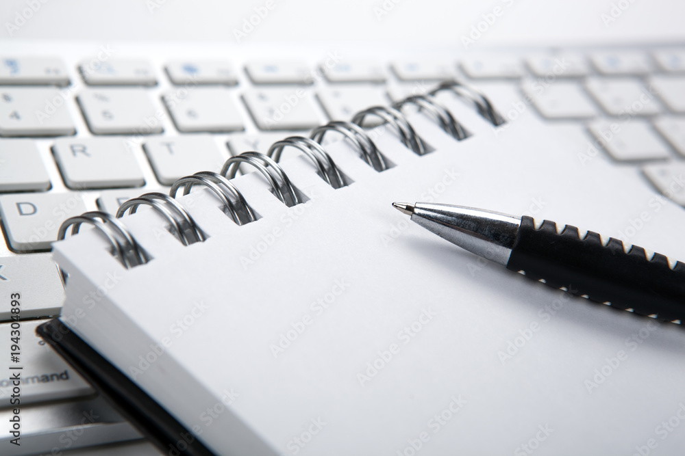 business still life of a notebook and keyboard on the desktop business still life of a notebook and keyboard on the desktop