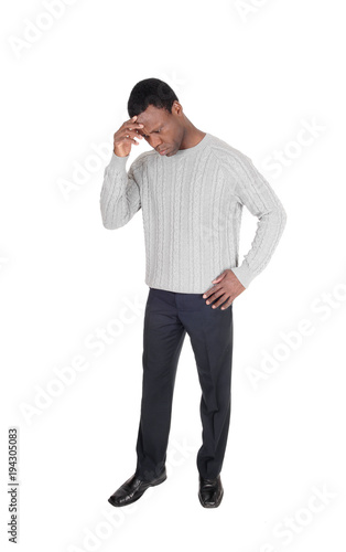 Depressed looking African man standing