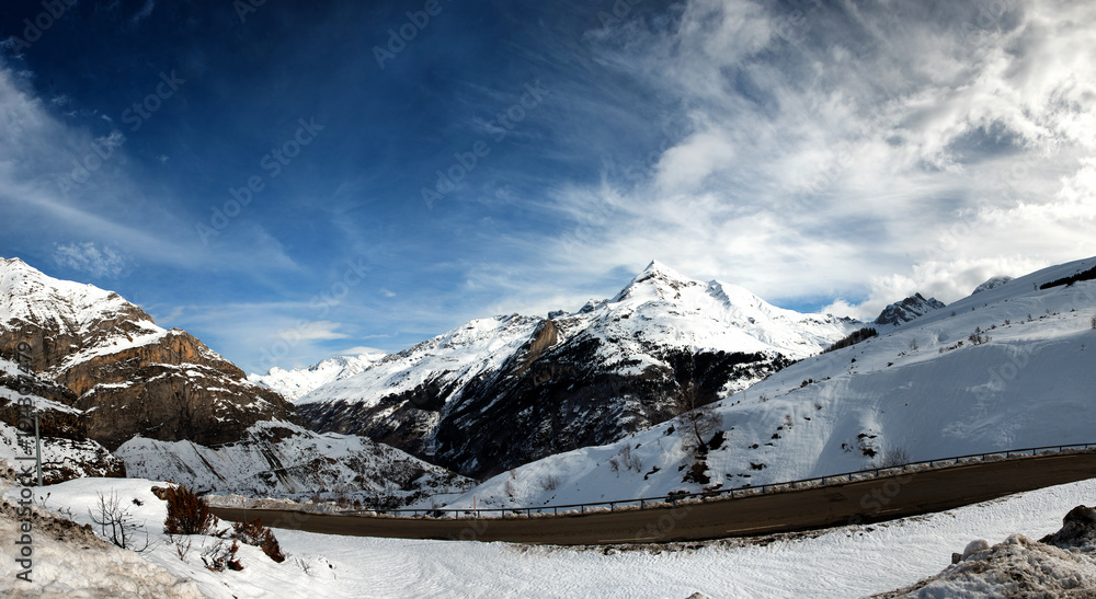 snowy Pyrenees mountains with small road