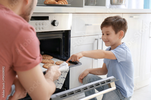 Little boy watching his fat...