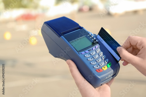 Woman using bank terminal f...