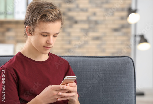 Teenage boy with hearing ai...