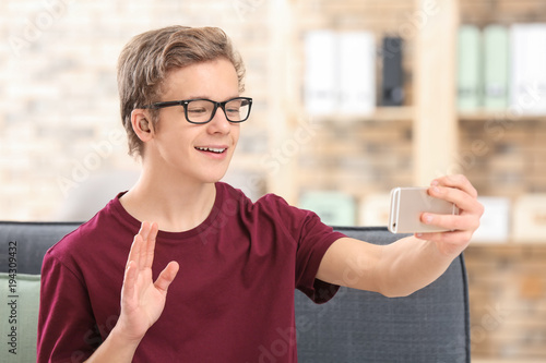 Teenage boy with hearing ai...