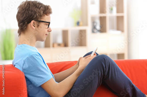 Teenage boy with hearing ai...