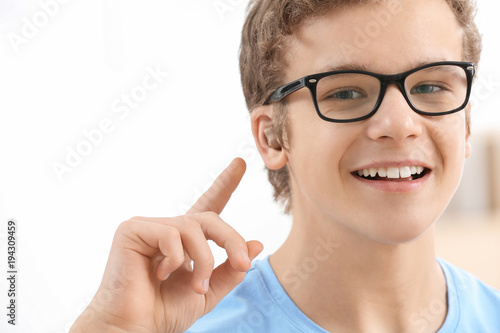 Teenage boy with hearing ai...