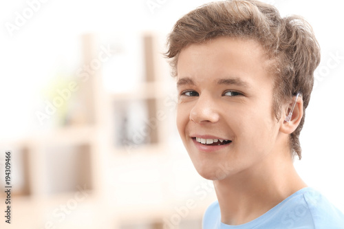Teenage boy with hearing ai...