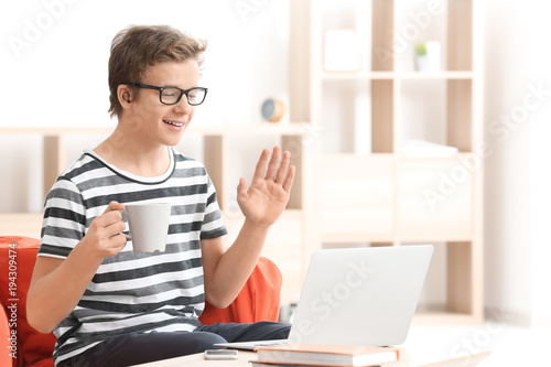 Teenage boy with hearing ai...