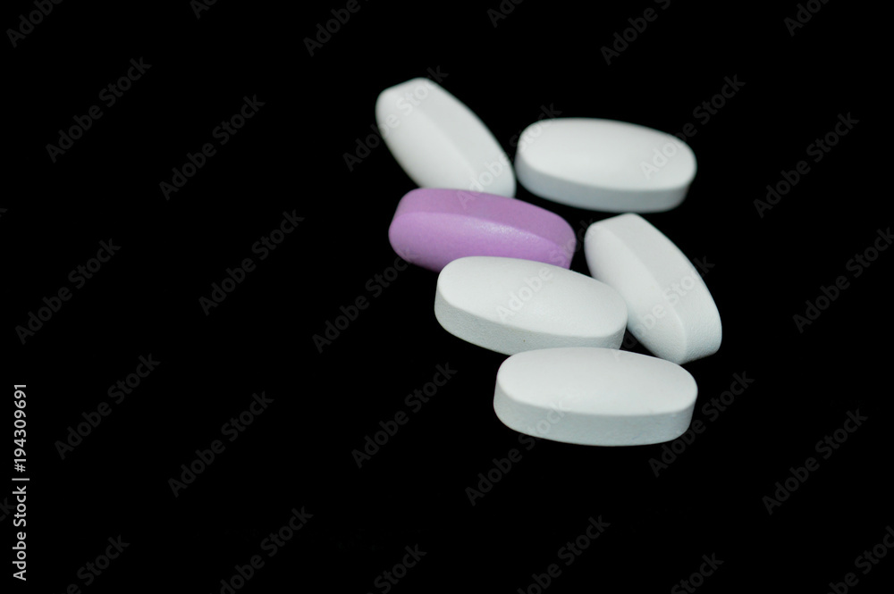 Medication pills of different colors. Medication pills of different colors.