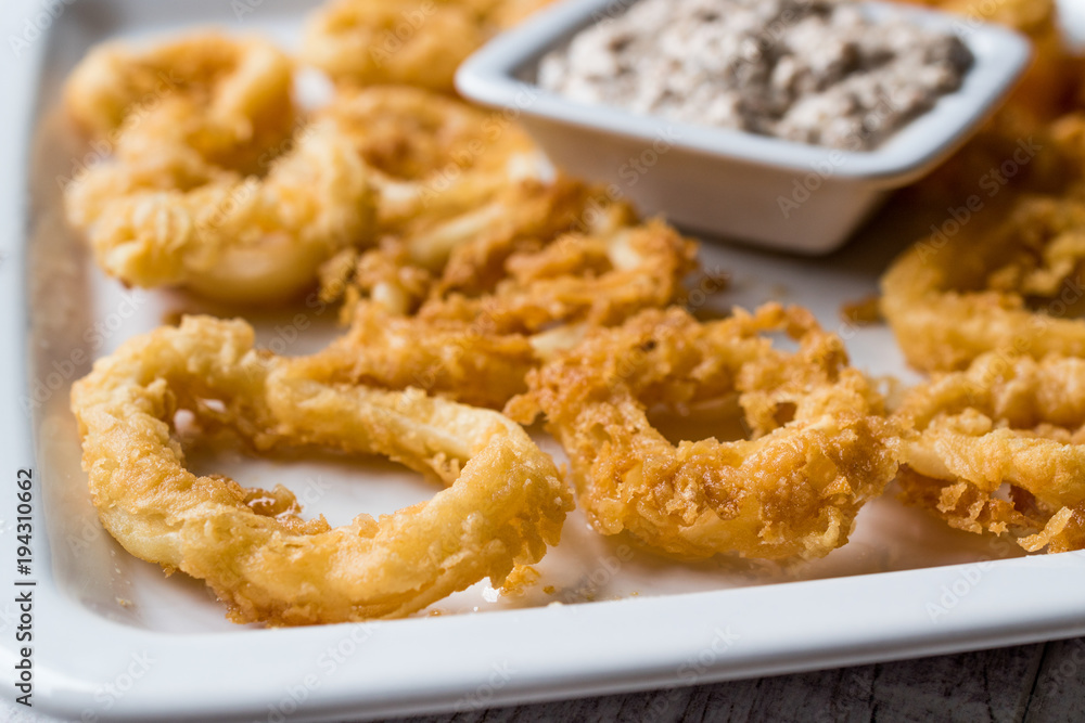 Fried Crispy Calamari Squid Rings with Tartar Sauce and Lemon. Fried Crispy Calamari Squid Rings with Tartar Sauce and Lemon.