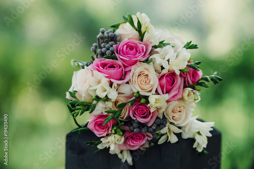 beautiful wedding bouquet with white and pink roses and other colorful flowers
