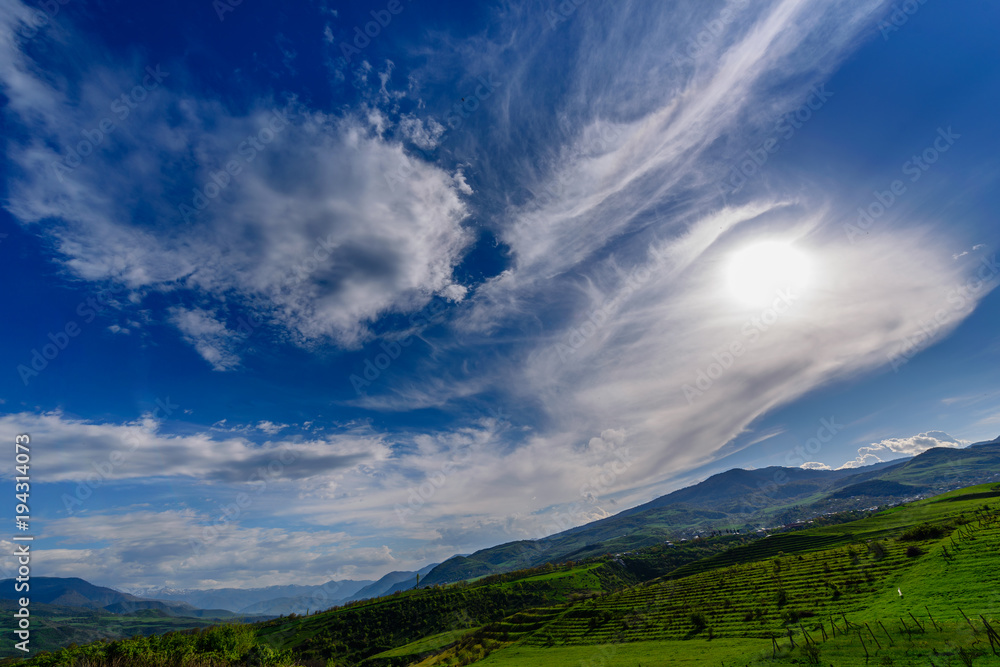 Amazing spring skyscape with beautiful clouds and green field, Armenia Amazing spring skyscape with beautiful clouds and green field, Armenia