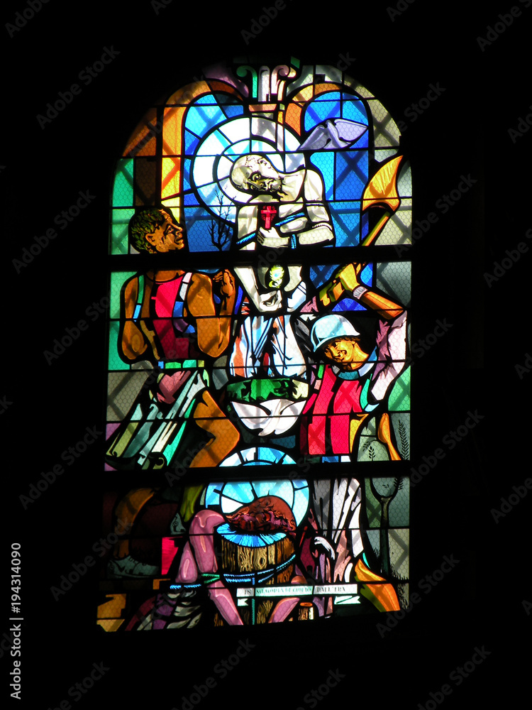 stained-glass windows of the Church, the beautiful colors of the glass mosaic