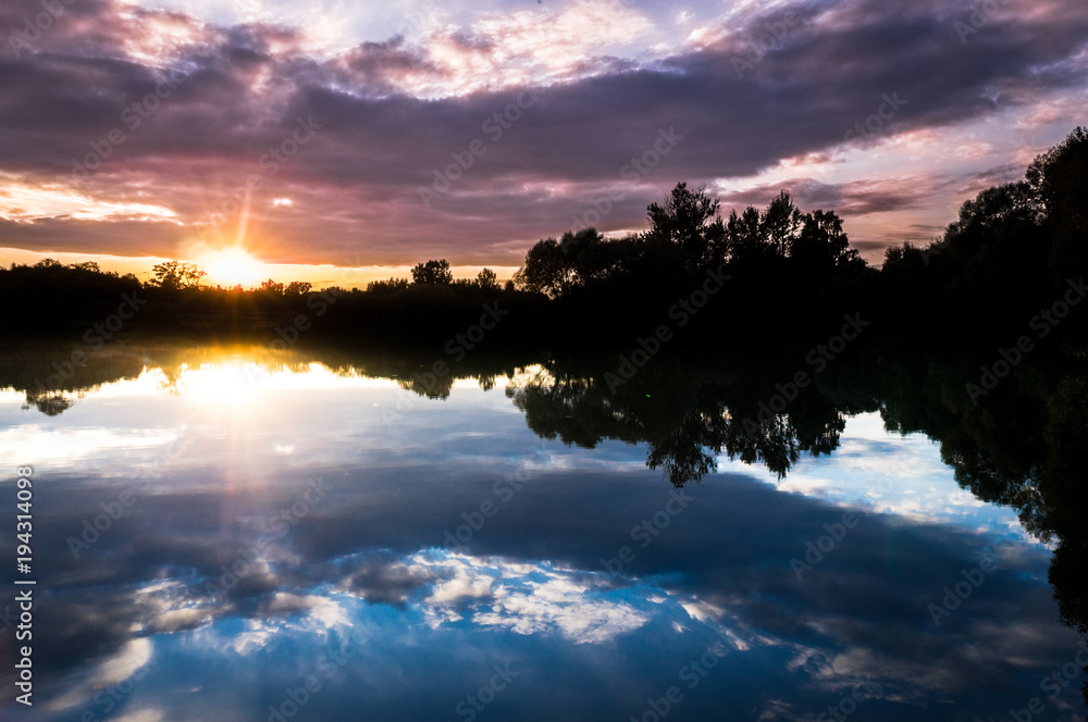 Summer sunset, reflection in the lake Summer sunset, reflection in the lake