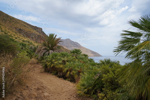 Walking path in mountains next to the sea