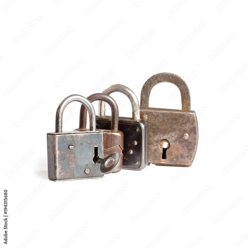 Fototapeta premium Retro style padlocks on white background. metal textures pattern. key in hole