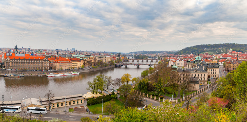 Wide panoramic view of Prague over Vltava river. Heart of old town. Czech Republic. Spring time.
