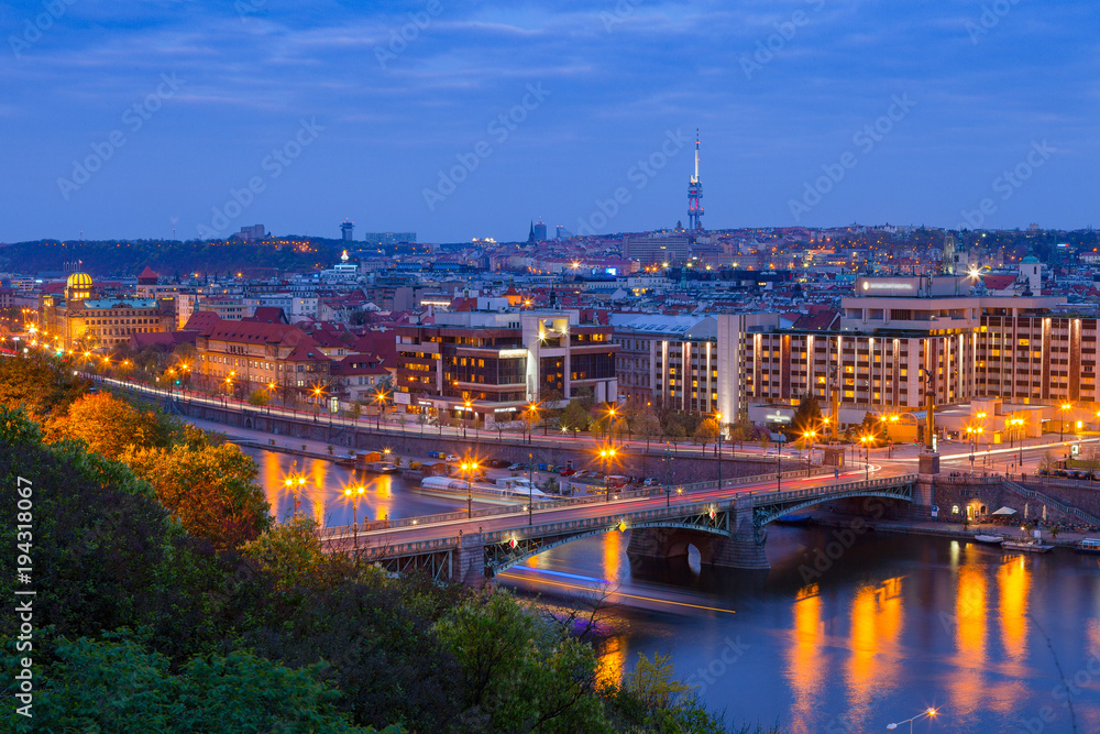 Cechuv bridge night view from Letenske garden. Panorama with historic part of town and Vltava river. Prague, Czech Republic