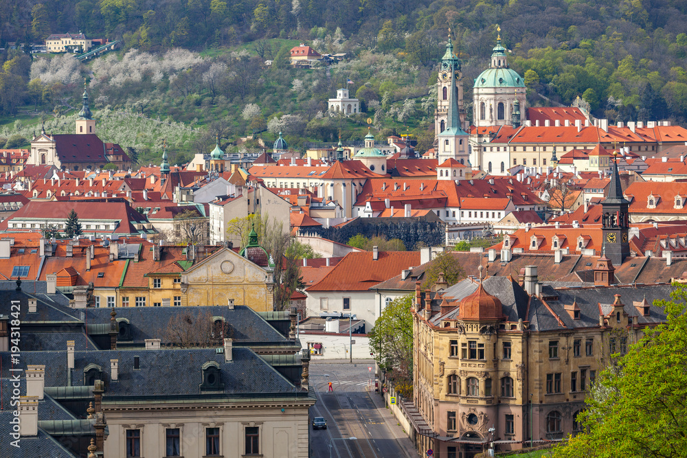 Prague rooftops. Beautiful aerial view of Mala Strana area architecture with red roofs, towers and churches