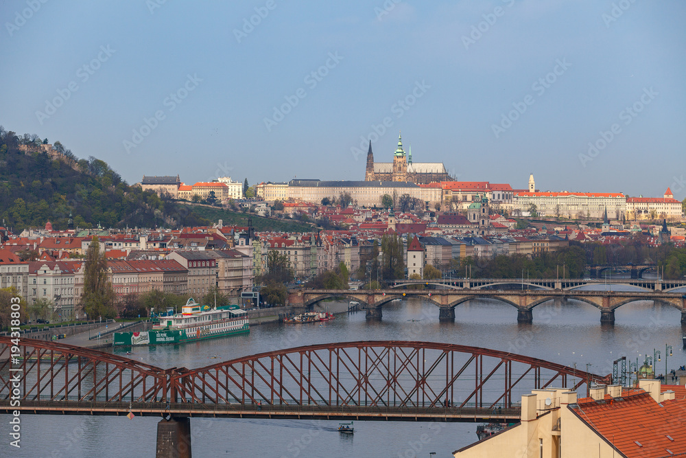 View of Vltava river in Prague and Charles bridge and the Castle with railway bridge at the foreground, Czech Republic