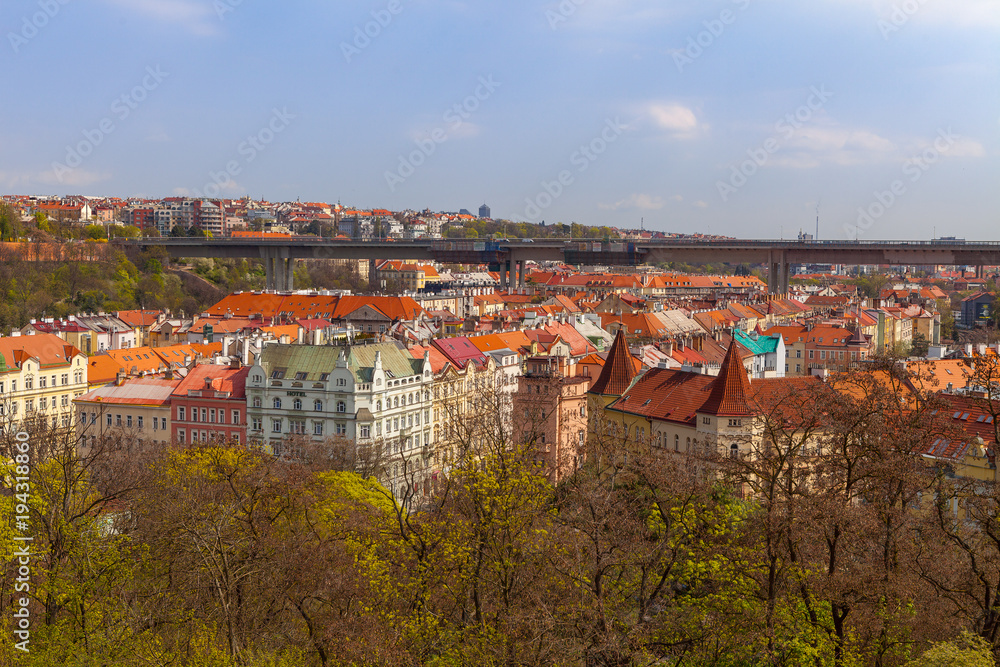Prague living blocks red rooftops with park and trees