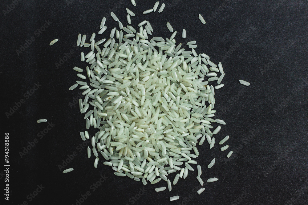 Closeup rice on black stone background