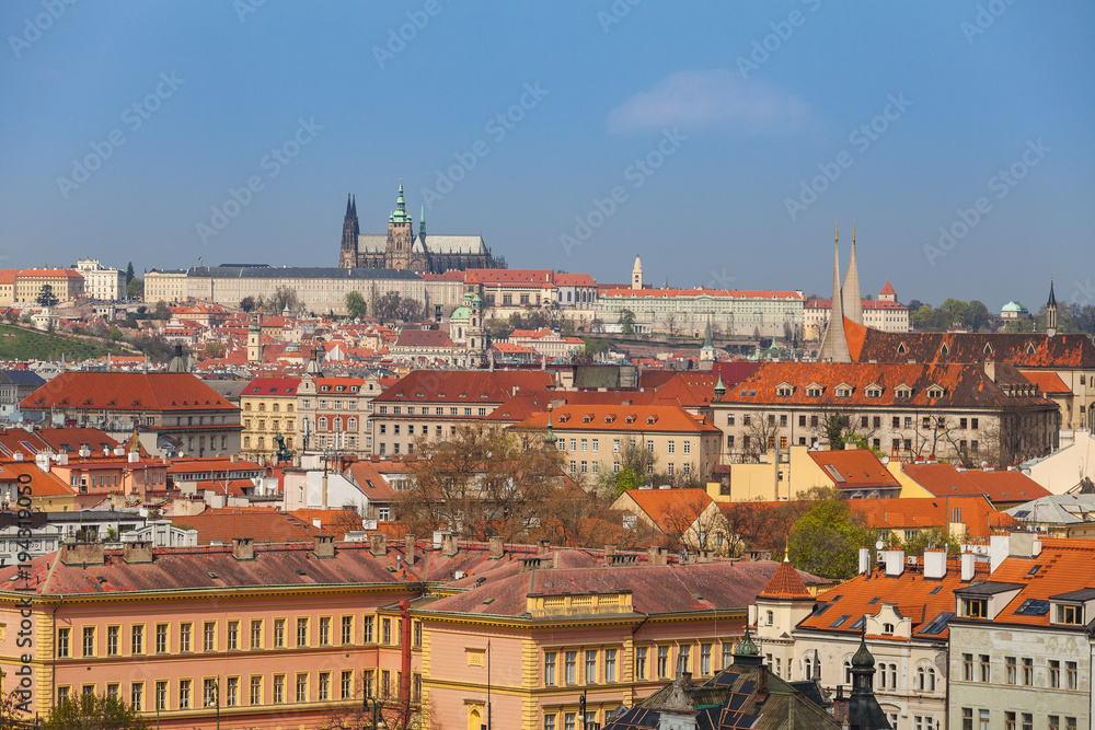 Obraz premium Prague rooftops. Beautiful aerial view of Czech baroque architecture, churches and cathedral.