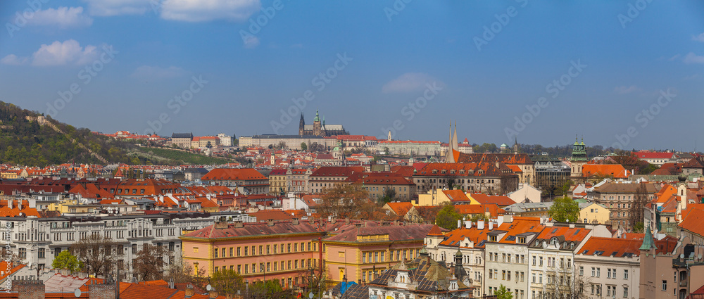 Prague rooftops. Beautiful aerial wide panoramic view of Czech baroque architecture, churches and cathedral.