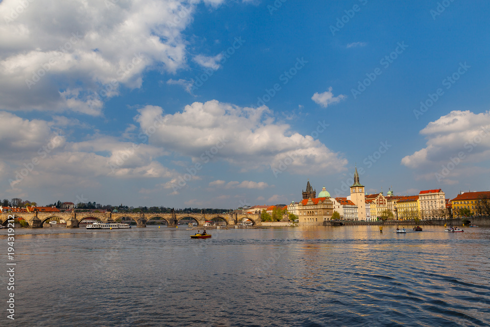 View on the river Vltava with boats. Old town of Prague, Czech Republic, summer season.