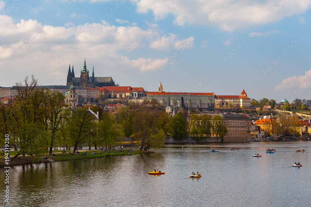 View on the river Vltava with boats. Old town of Prague, Czech Republic, summer season.