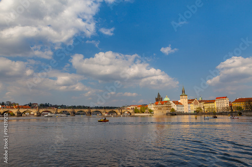 View on the river Vltava with boats. Old town of Prague, Czech Republic, summer season.