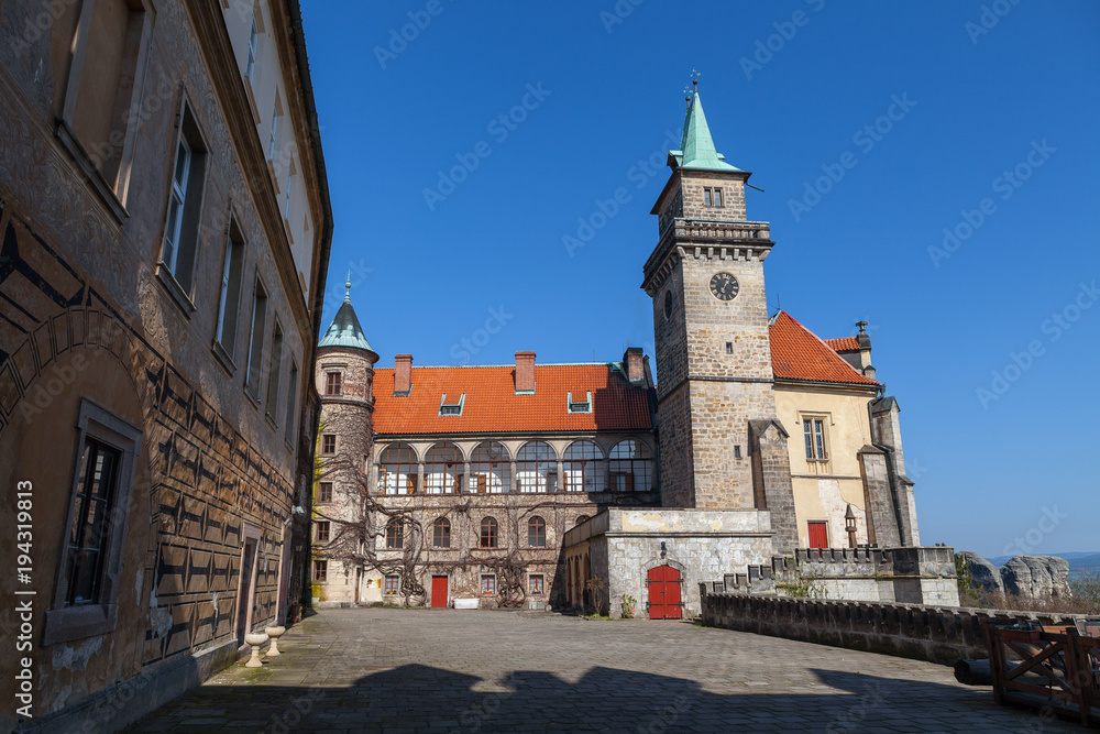 Courtyard and a tower in Castle Hruba Skala, Czech Republic. Summer time.