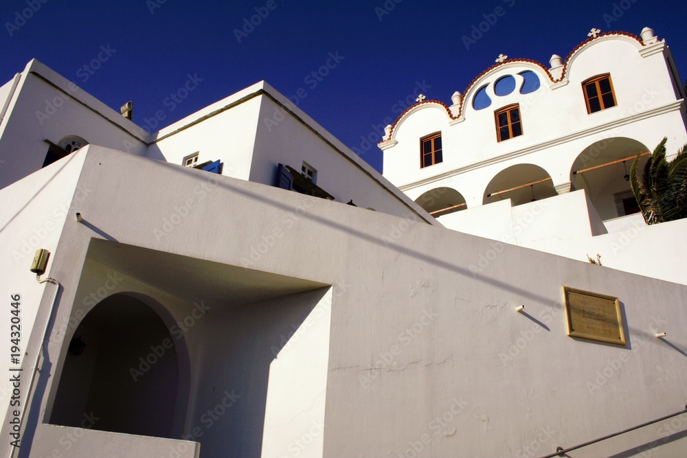 Triantaros village, Tinos island, Cyclades, Greece, typical architecture of Tinos island, Greek orthodox church in the background.