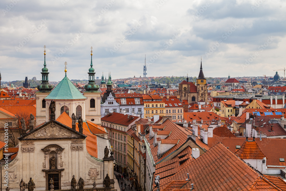 View of old city roofs with The Church of St. Francis, Klementinum, Prague, Czech Republic