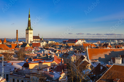 Tallinn old town architecture ensemble. Aerial view of towers, red roofs and biggest church