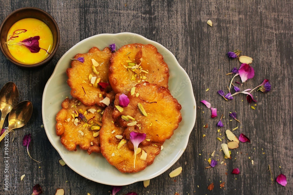 Malpua Traditional Indian sweet pancake coated in sugar syrup Stock