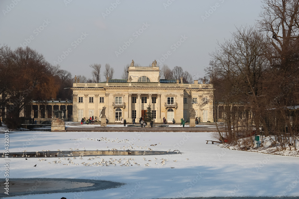 Baroque building of the Palace on the Isle under the cloudy sky, Warsaw Royal Baths Park, Poland