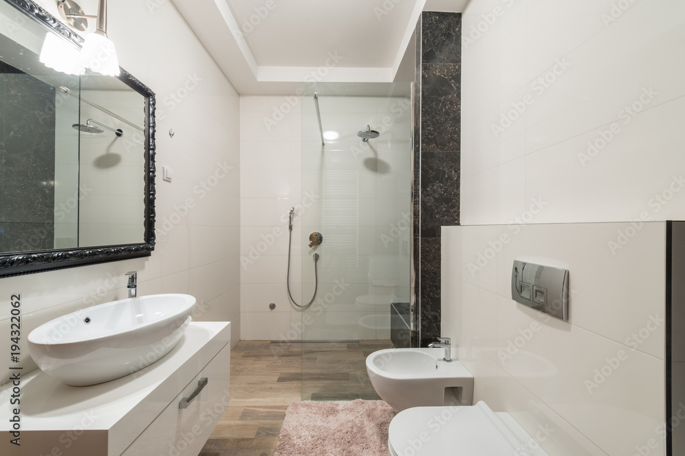 Modern bathroom interior with shower cabin in luxury villa Modern bathroom interior with shower cabin in luxury villa