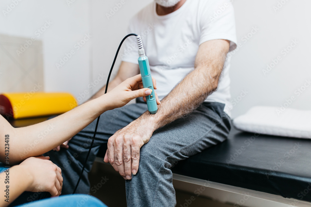 The older man at rehabilitation center.