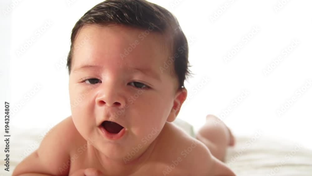 Close up Happy baby on the bed. Close up Happy baby on the bed.