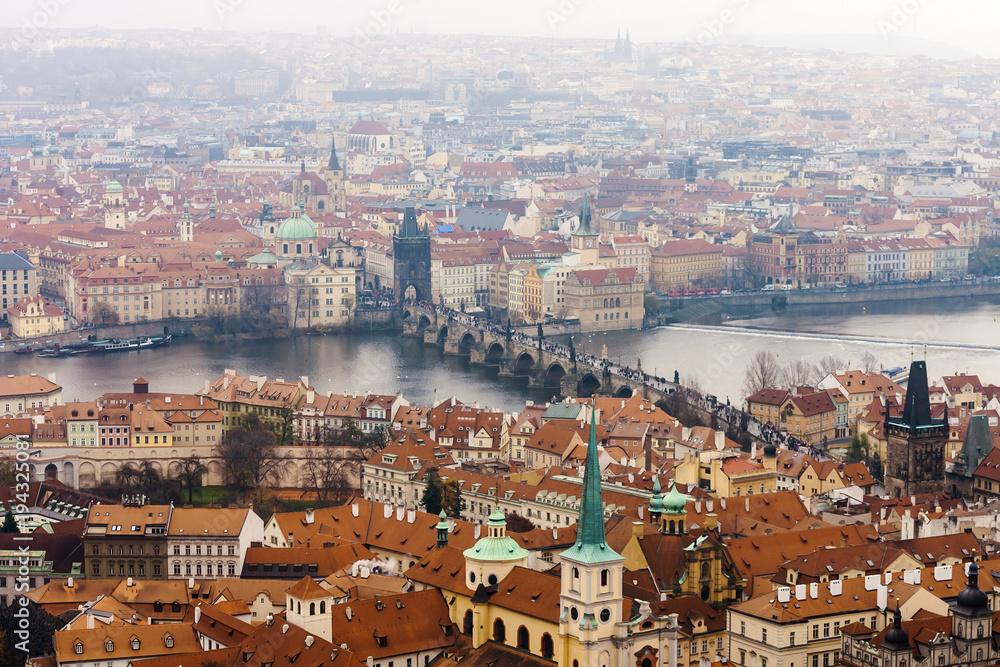 View of Praha with Vltava river and Charles Bridge from Prague Castle on rainy day