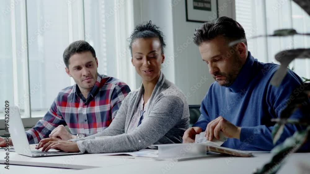 Multi-ethnic colleagues in a coworking office. Multi-ethnic colleagues in a coworking office.