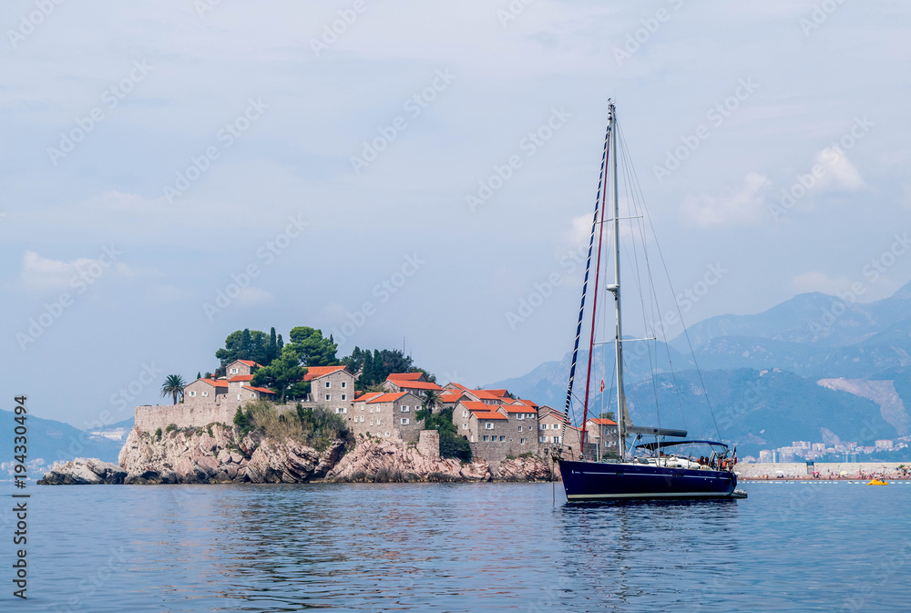 Sveti Stefan and a boat, Montenegro Sveti Stefan and a boat, Montenegro