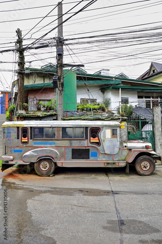Filipino grey-silvery dyipni-jeepney car stationed in Baguio town-Benguet province-Philippines. 0247