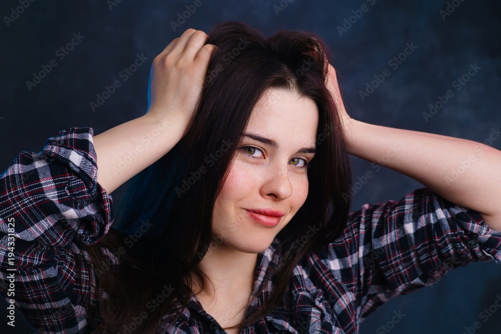 Young beautiful woman with long dark hair studio shoot. Natural beauty, healthy skin and hair concept Young beautiful woman with long dark hair studio shoot. Natural beauty, healthy skin and hair concept