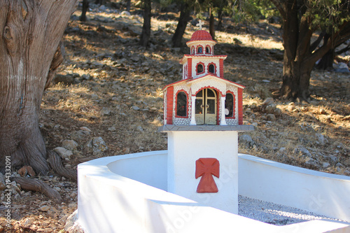 Greek kandilakia, miniature churches on the roads. A small village iconostasis, reminiscent of a church small copy for lighting candles. Greece photo