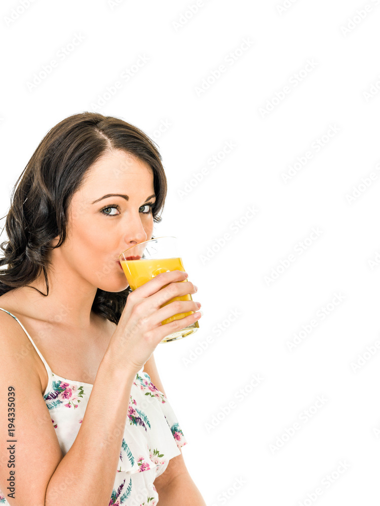 Young Woman Holding And Drinking A GLass Of Fresh Healthy Orange Juice Young Woman Holding And Drinking A GLass Of Fresh Healthy Orange Juice