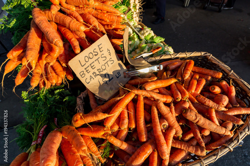 Carrots for sale at a farmers market in the morning.